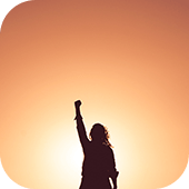 Person silhouette with fist in the air